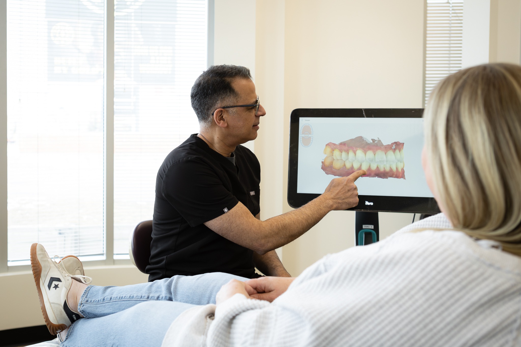 Dr. Moez Lakhani with Patient | Millennium Dental | General & Family Dentist | SE Calgary